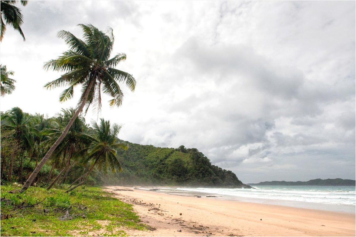 The wild, near-empty sand of Duli Beach north of El Nido, Palawan, Philippines
