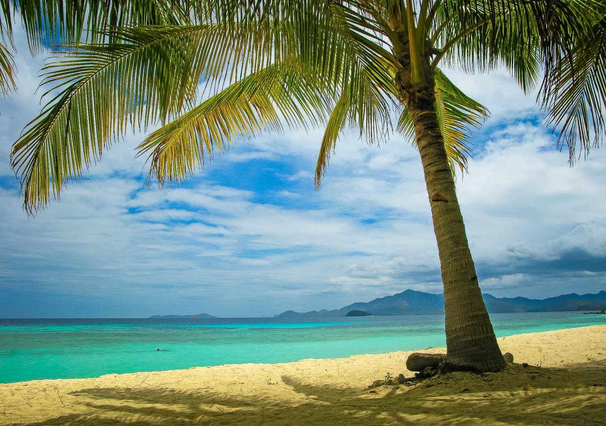White sand and turquoise water at Malcapuya Island near Coron, Palawan, Philippines