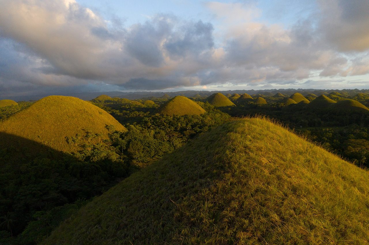 Aerial view of the Chocolate Hills of Bohol stretching to the horizon