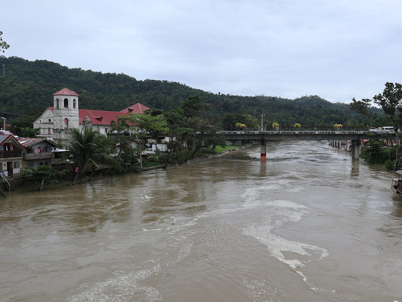 The Loboc River and the red-roofed Loboc church in Bohol, departure point for the floating-restaurant cruises