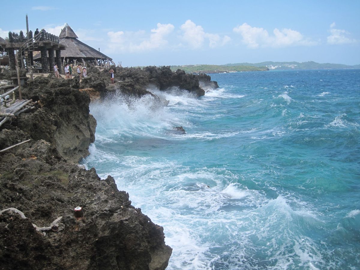 Rocky coastline and turquoise cove at Crystal Cove Island near Boracay