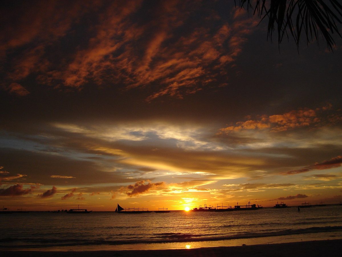 Sunset over White Beach, the strip at the centre of Boracay nightlife