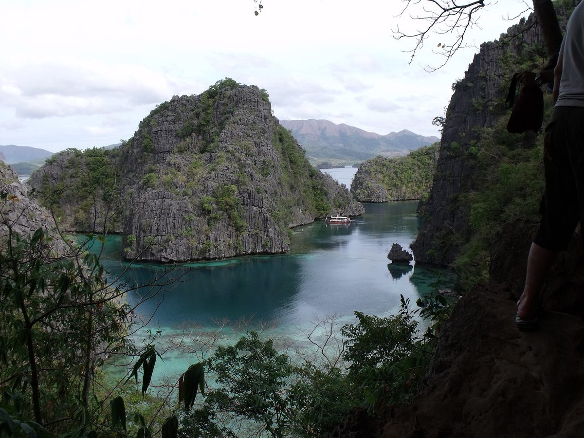 Kayangan Lake in Coron framed by limestone cliffs, the signature stop on any coron island hopping tour in Palawan, Philippines