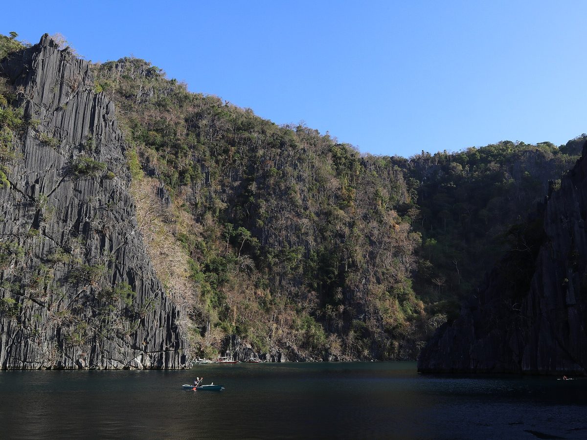The Twin Lagoon near Coron, two basins of green water separated by limestone karst in Palawan, Philippines