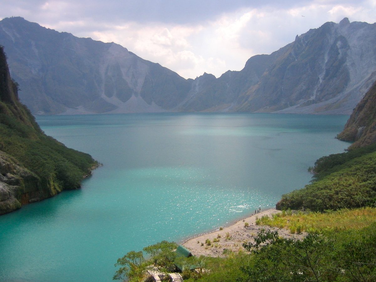 The turquoise crater lake of Mount Pinatubo reached by 4x4 and a short trek north of Manila