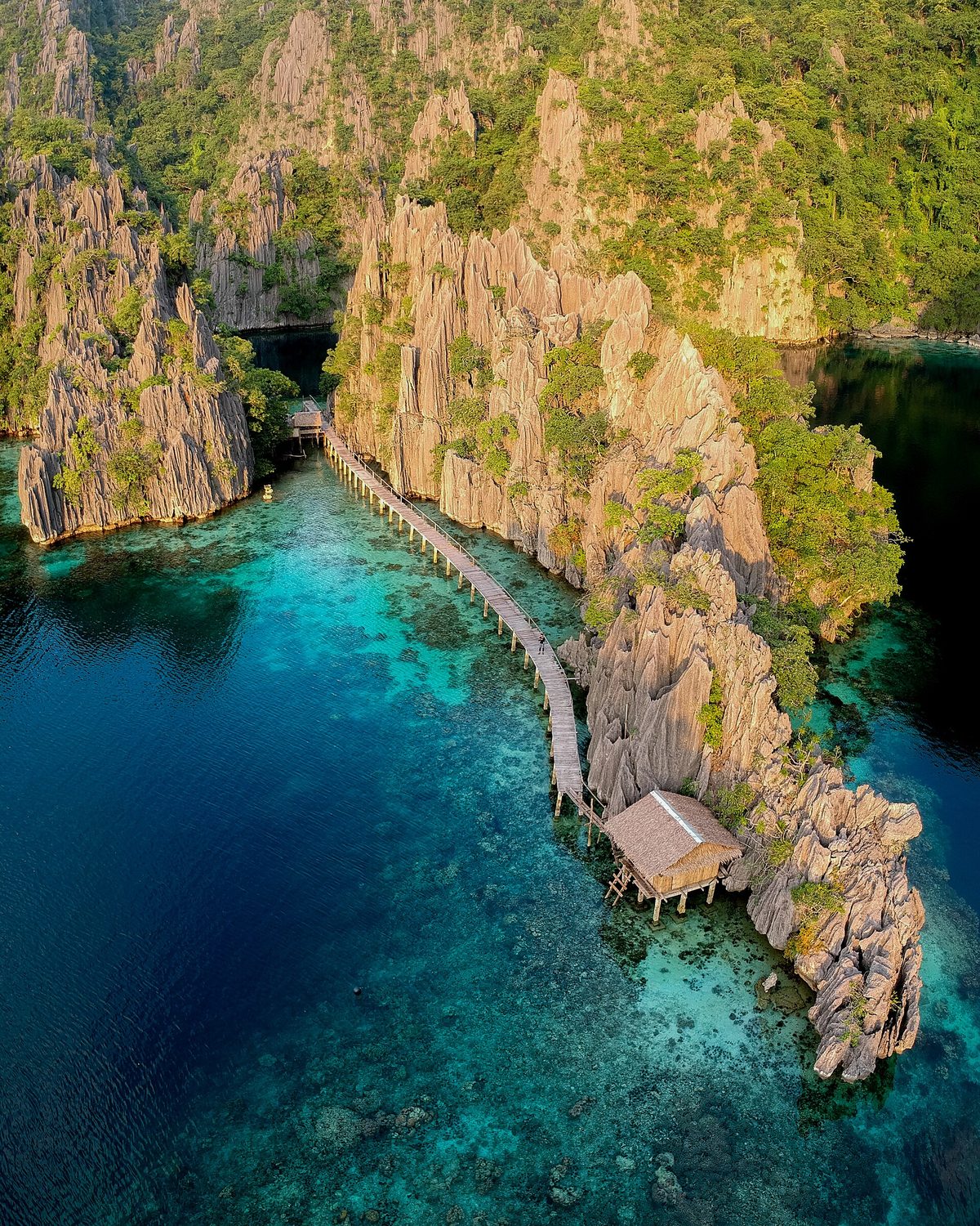 Aerial view of limestone islands and turquoise lagoons in the Calamian group near Coron, Palawan, Philippines, the final stretch of the el nido to coron route