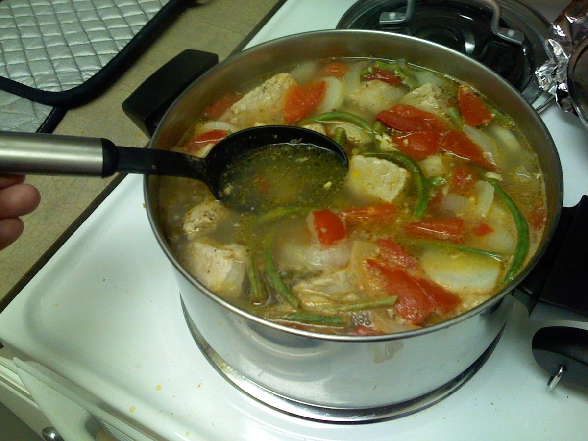 Sinigang, a sour Filipino tamarind soup with pork and vegetables