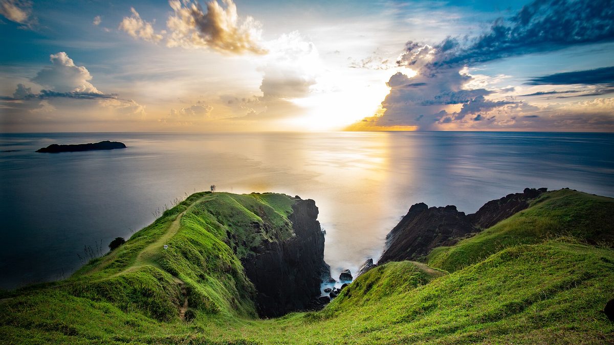 Green rolling headland at Binurong Point on the surf coast of Catanduanes, Philippines