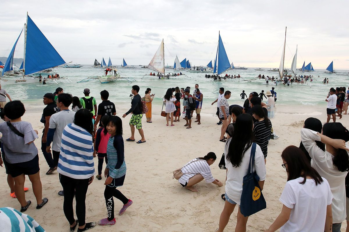 Boats lined along the Boracay shoreline after the crossing from Caticlan