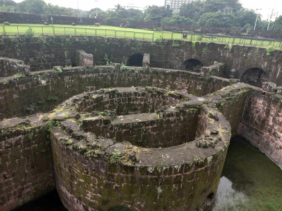 Ruined circular bastion of Baluarte de San Diego with gardens inside Intramuros