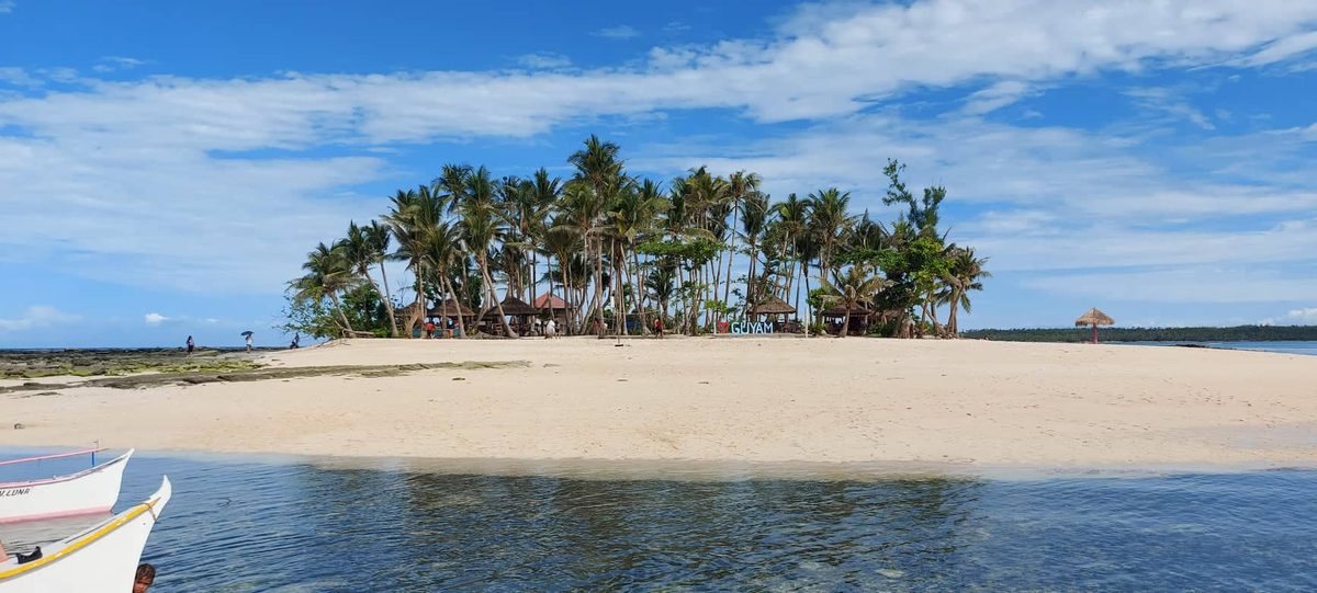 Tiny palm-covered Guyam Island near Siargao, a popular three-island day-tour stop