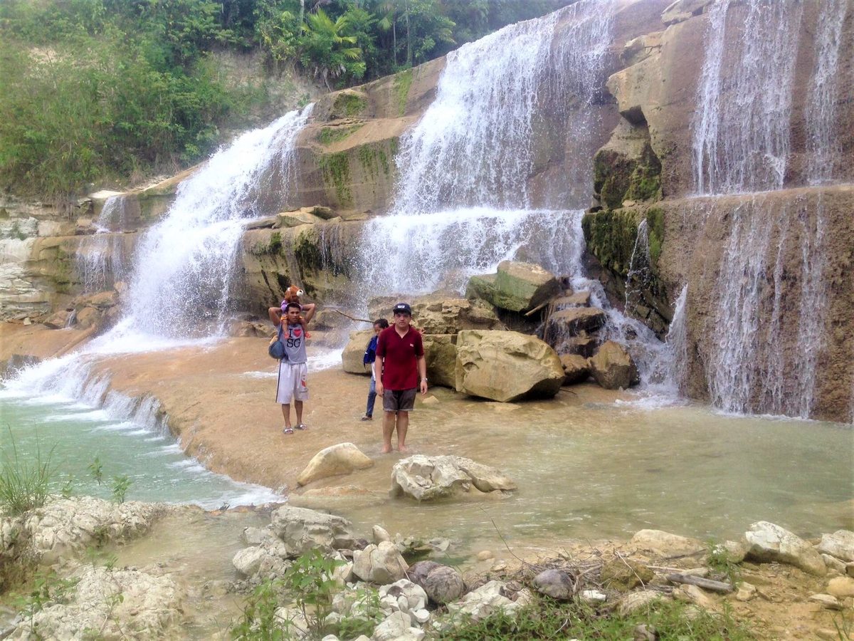 A tiered waterfall in the forested canyon of South Cebu, Philippines