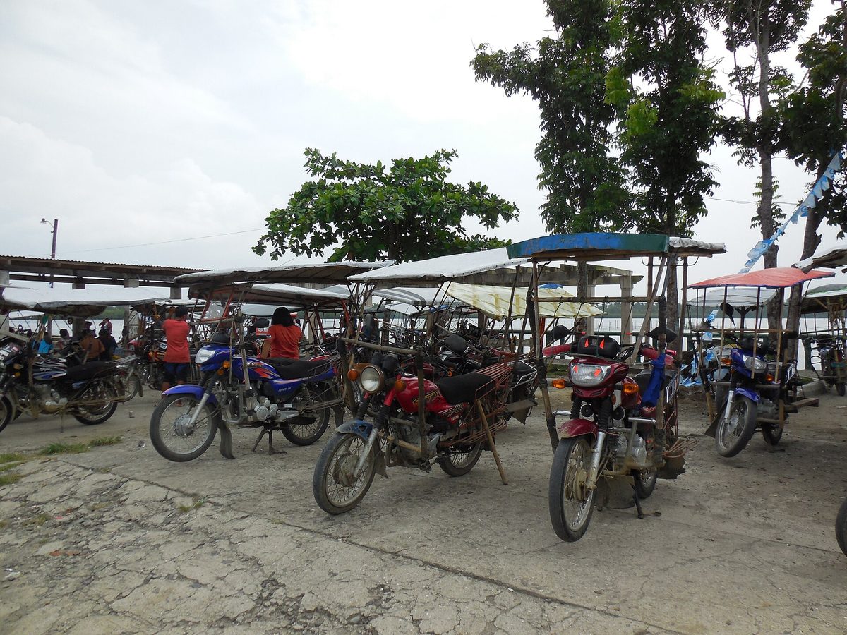 A habal-habal motorcycle taxi carrying a passenger in the Philippine provinces