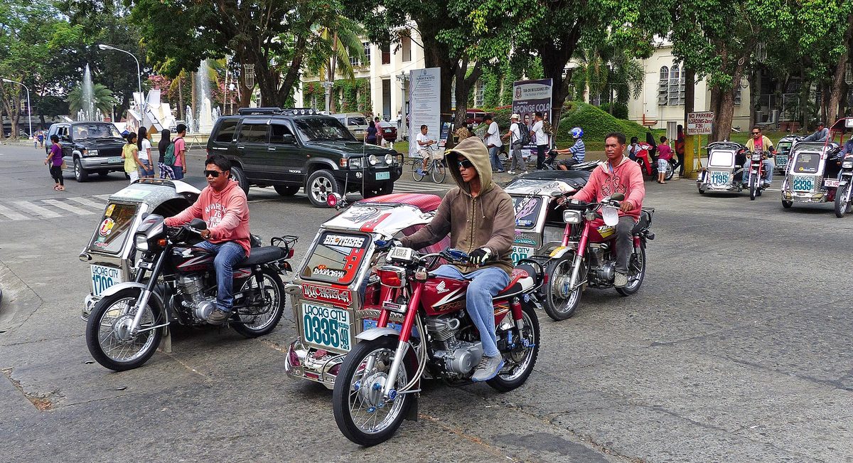 A Philippine tricycle, a motorbike with a sidecar used for short last-mile rides in towns