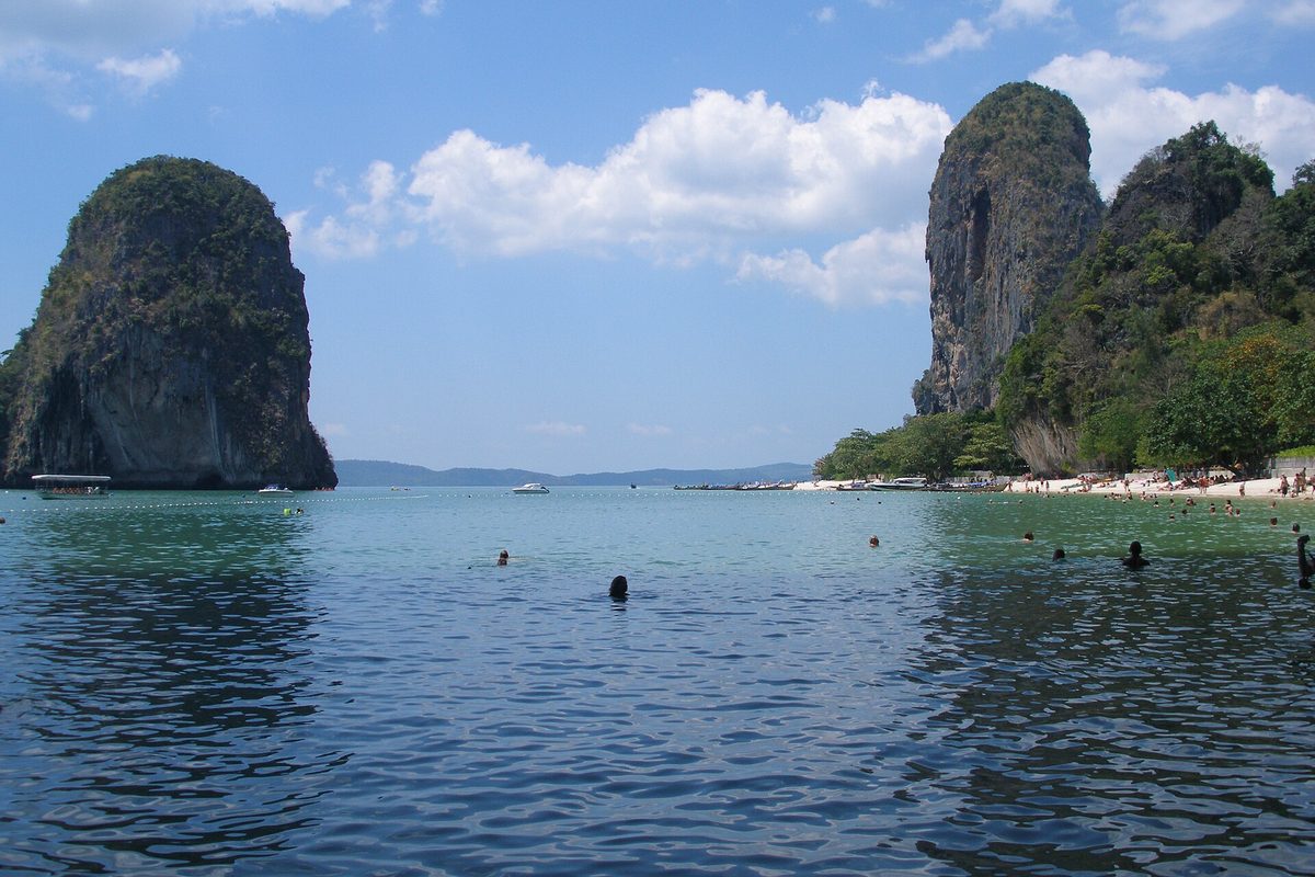 Railay Beach in Krabi, Thailand, framed by limestone cliffs