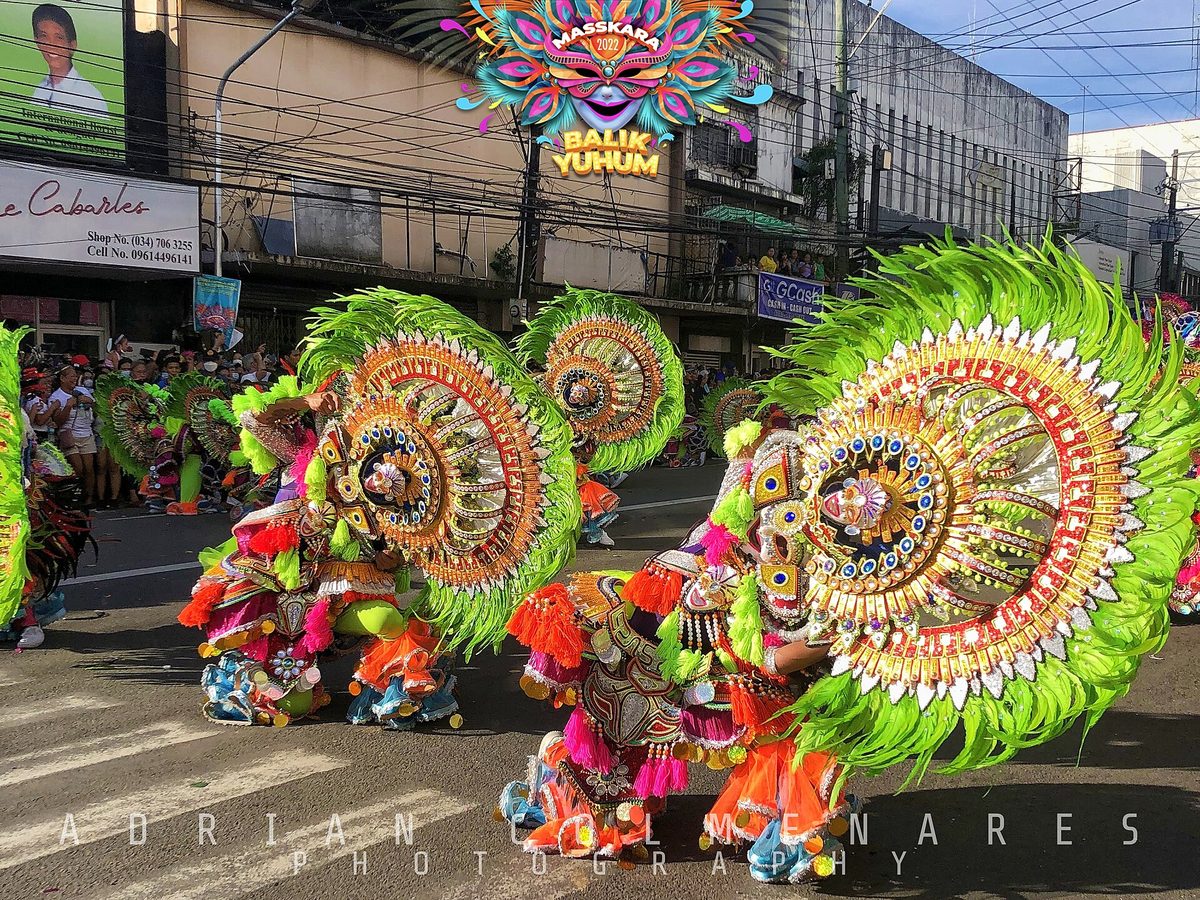 Dancers in smiling masks at the MassKara Festival in Bacolod