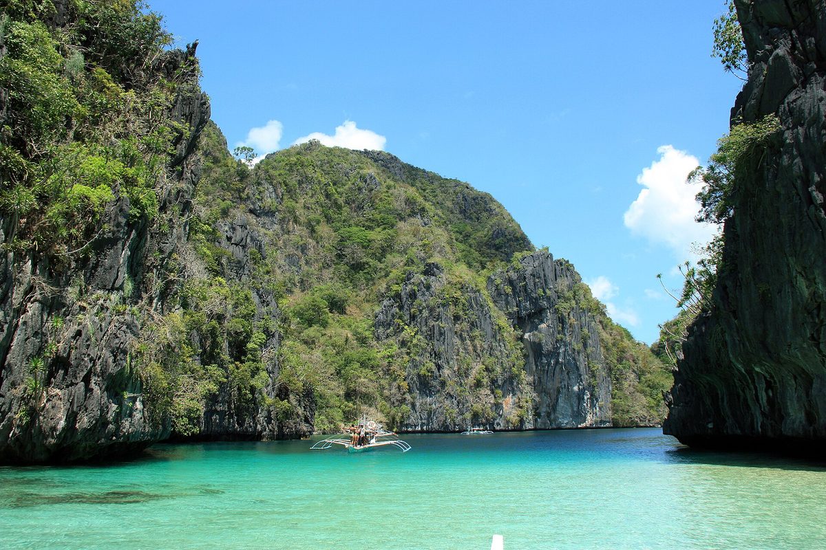 Karst cliffs and turquoise lagoon water at El Nido, the Palawan stop on this philippines itinerary 1 month