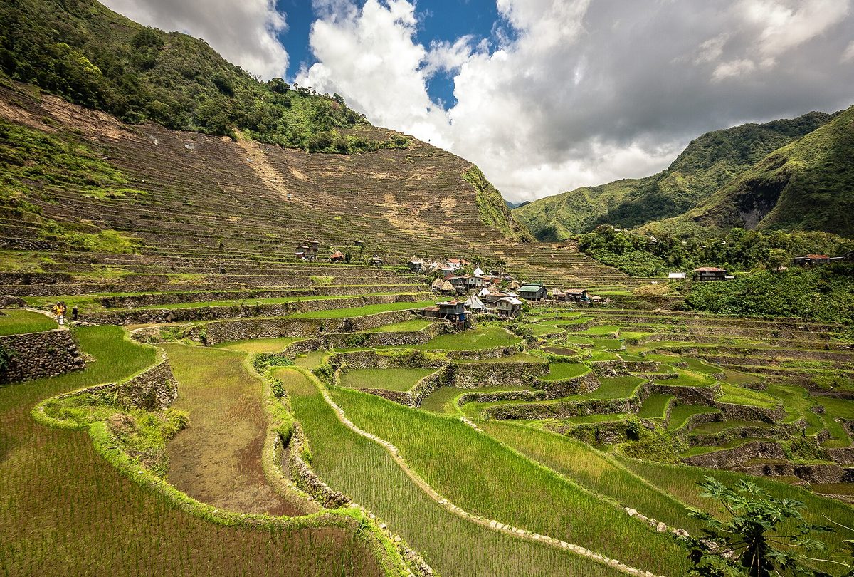 A hiker at the Batad rice terraces in the Philippines, a reminder to pack a light closed pair of shoes