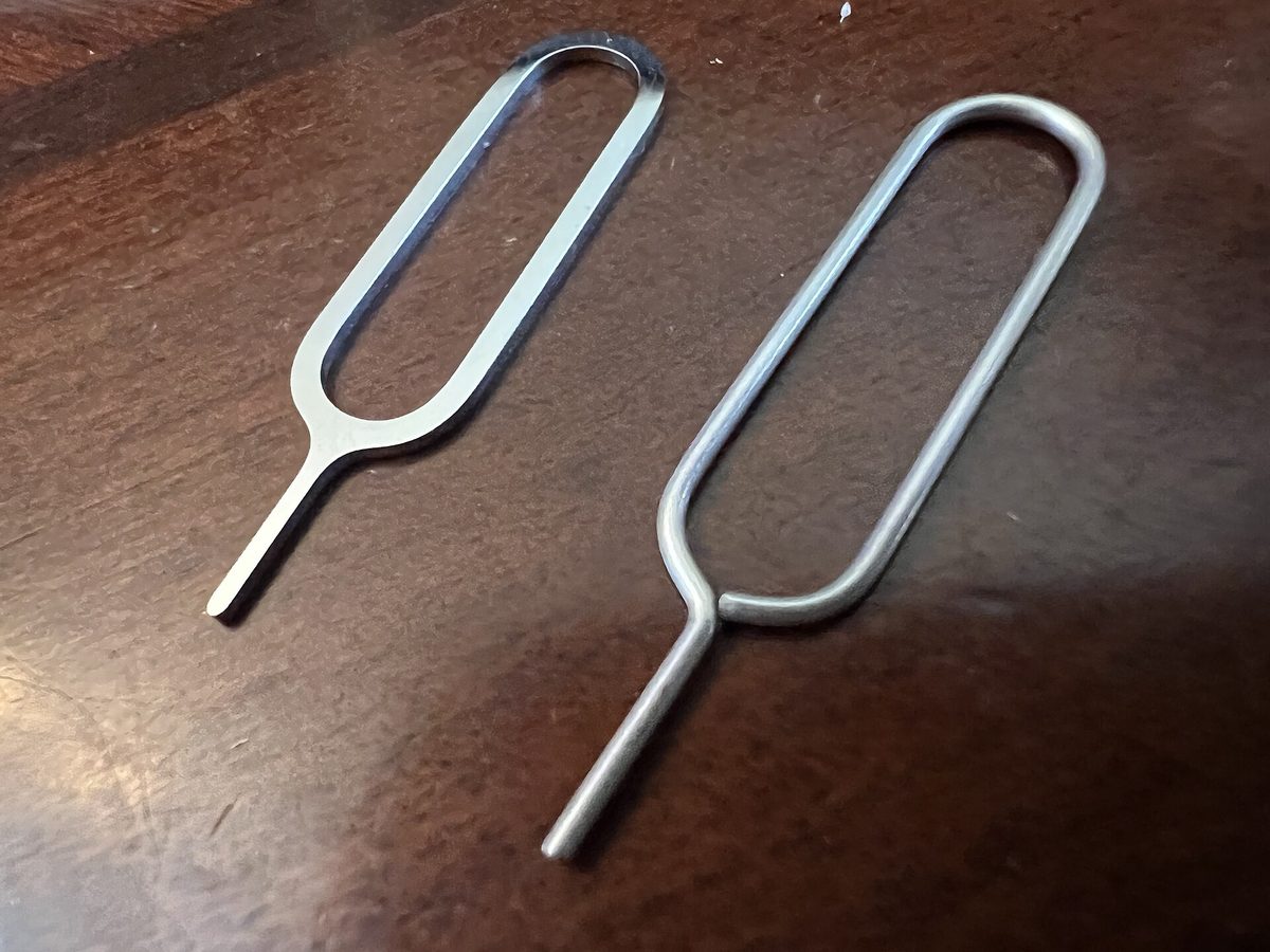 A SIM card tray ejected from a phone, ready for a Philippines SIM card