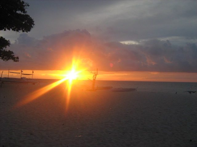 Sunset over Puka Beach Boracay, the long shell-sand bay on the island's quiet northern tip