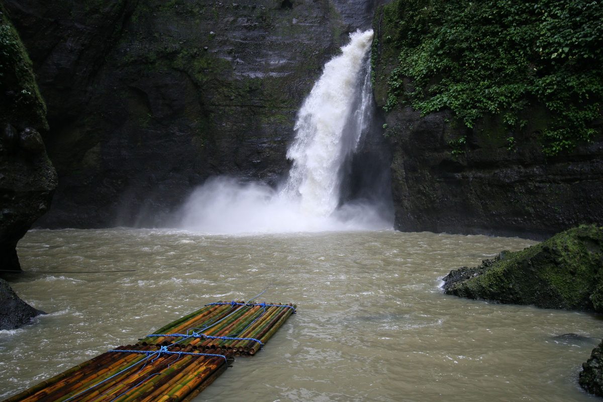 A full, thundering waterfall in the Philippines during the wet season