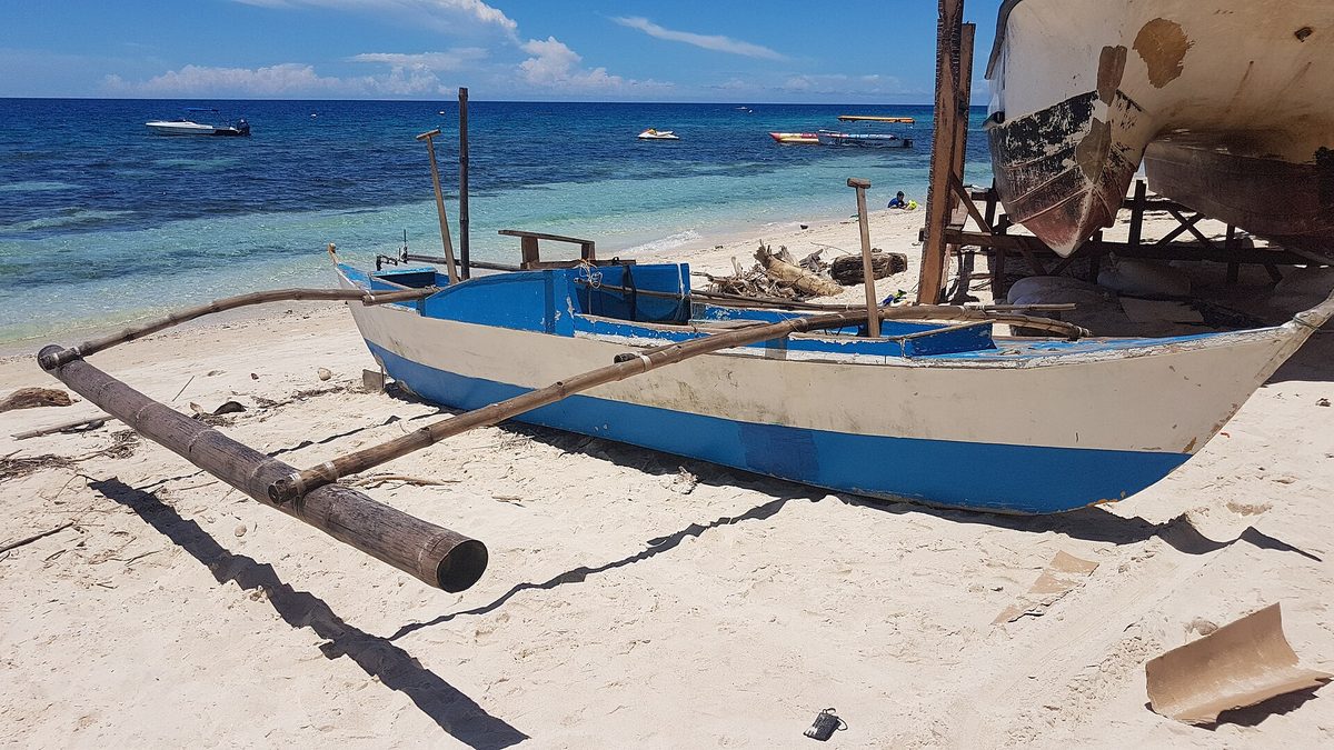 Traditional Philippine bangka outrigger boat, the type used to reach Sugba Lagoon and Siargao day trips