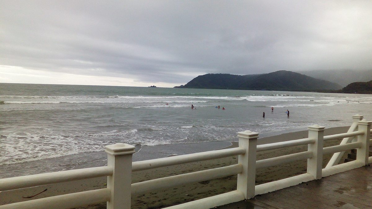 Surfers in the water at Sabang Beach in Baler, the birthplace of Philippine surfing