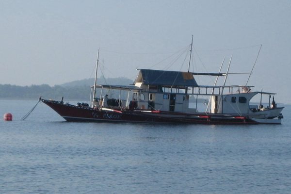 A liveaboard dive boat on calm open water, the only way to reach Tubbataha