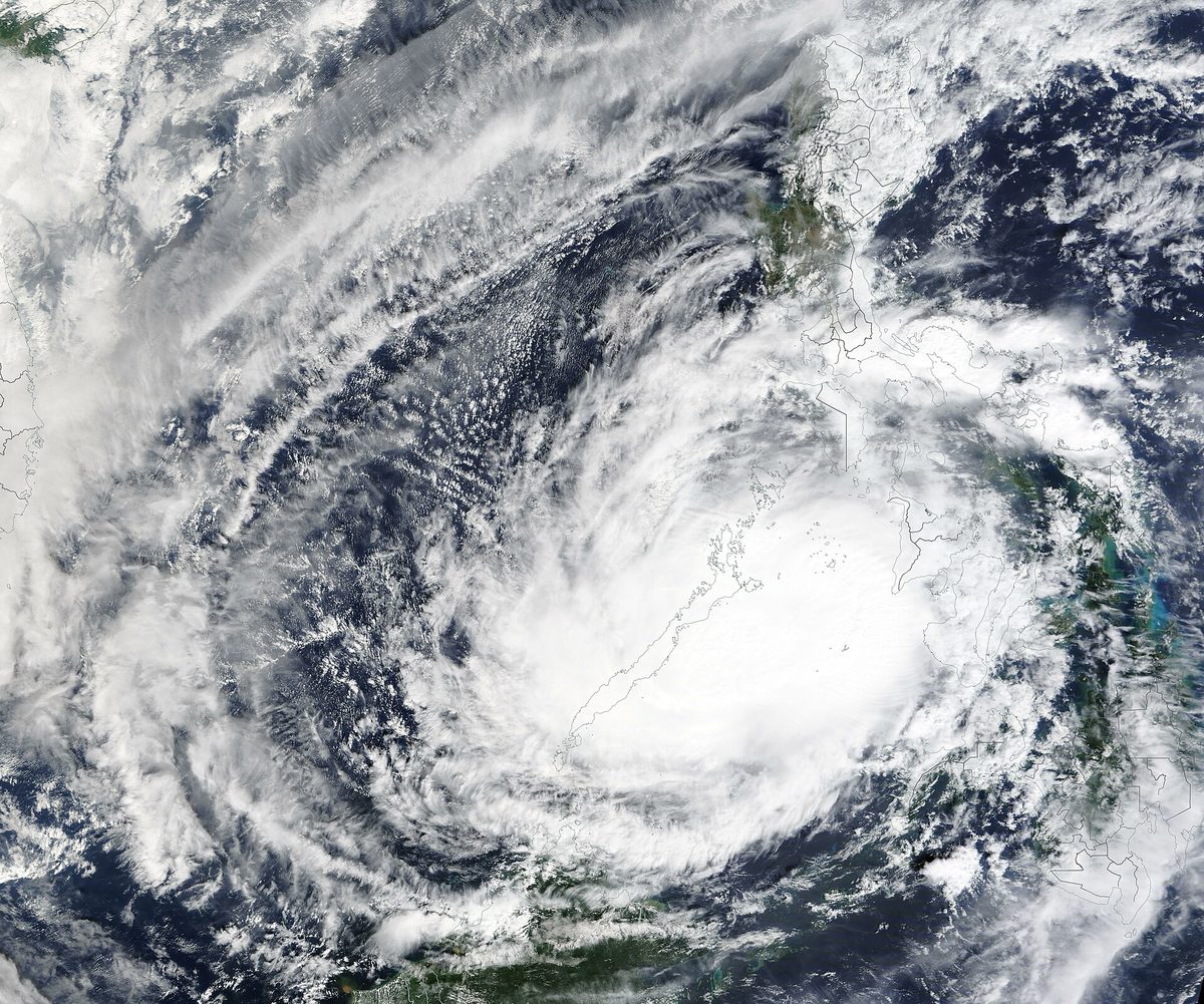 Satellite view of a tropical cyclone's spiral cloud band over the western Pacific near the Philippines