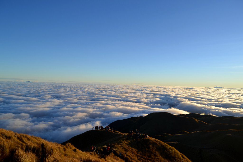 Sunrise sea of clouds over the grassland summit of Mount Pulag in Benguet