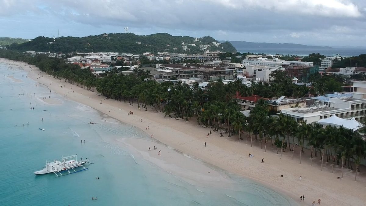 Aerial view of Boracay's curving White Beach and the turquoise water of the western shore