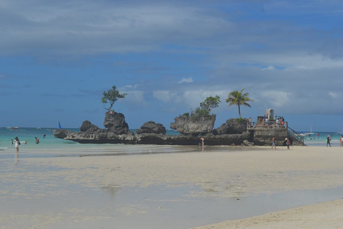 Willy's Rock, the volcanic formation with a Virgin Mary shrine at Station 1 of White Beach, Boracay