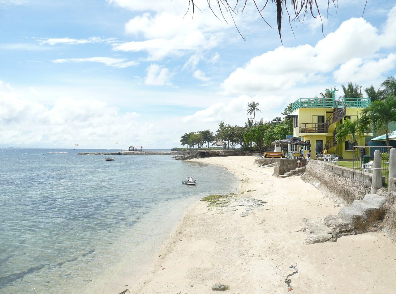 A beachfront with a small resort on Mactan Island, Cebu
